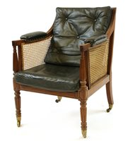 Lot 653 - A George III bergère library chair