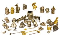 Lot 171 - A collection of twenty miniature helmets and various armour