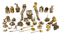 Lot 171 - A collection of twenty miniature helmets and various armour