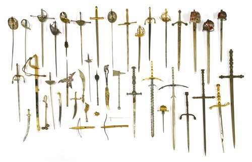 Lot 169 - A collection of thirty-two miniature swords