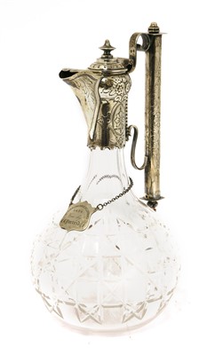 Lot 76 - A silver-mounted cut glass claret jug