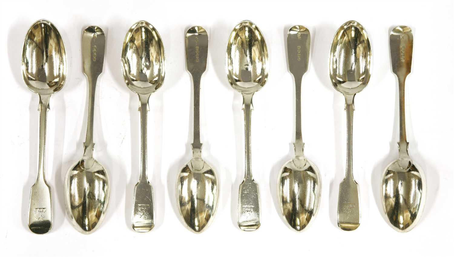 Lot 136 - A set of twenty-four Victorian silver fiddle pattern dessert spoons