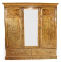 Lot 530 - A Victorian walnut triple door wardrobe