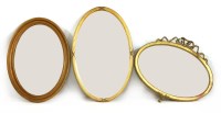 Lot 553 - A Victorian gilt framed and oval wall mirror