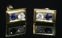 Lot 12A - A pair of gold two stone sapphire and diamond stud earrings