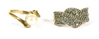 Lot 10A - A 9ct gold pave set twisted ribbon design ring