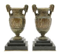 Lot 424 - A pair of 19th century classical style bronze twin handled urns