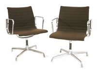 Lot 305 - A pair of Charles and Ray Eames swivel armchairs