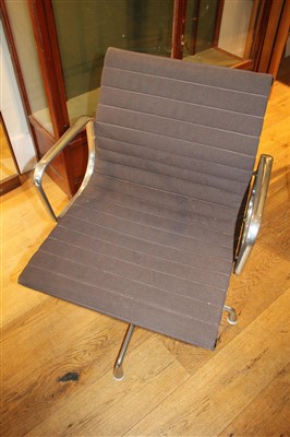 Lot 305 - A pair of Charles and Ray Eames swivel armchairs