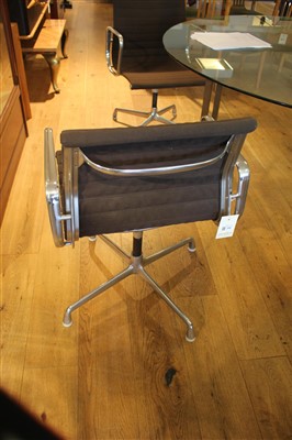 Lot 306 - Two Charles and Ray Eames swivel armchairs