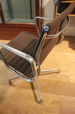 Lot 306 - Two Charles and Ray Eames swivel armchairs