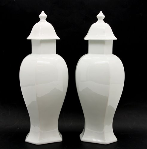 Lot 363 - A pair of Limoges porcelain lidded temple jars
