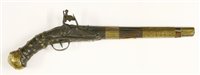 Lot 393 - A Middle Eastern walnut flintlock pistol