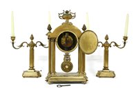 Lot 168 - A late 19th century French brass clock garniture. 47cm high