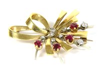 Lot 41 - a gold ruby and diamond brooch
