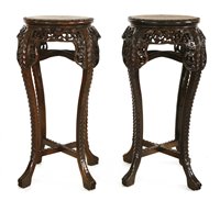 Lot 325 - A pair of Chinese hardwood jardinière stands