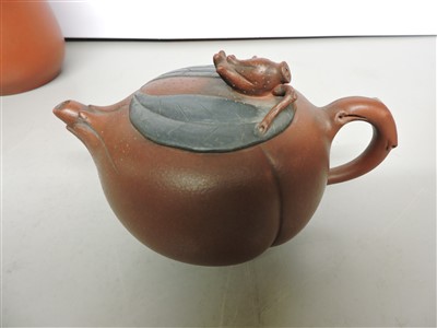 Lot 495 - A collection of three Yixing teapots