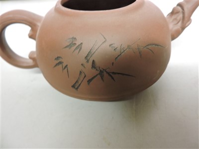Lot 495 - A collection of three Yixing teapots