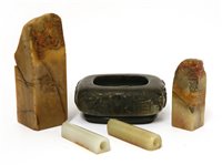 Lot 388 - Four soapstone seals and a brush washer