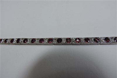 Lot 178 - An Art Deco ruby and diamond line bracelet