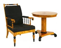 Lot 685 - A Biedermeier-style satin birch and ebonised centre table