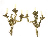 Lot 852 - A pair of Louis XV-style gilt bronze three-branch wall lights