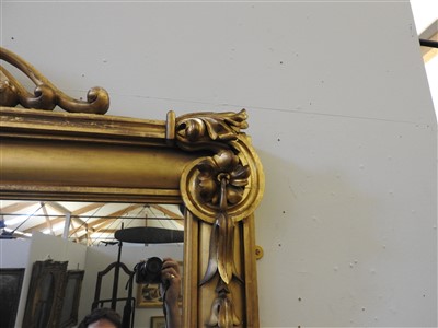 Lot 410 - A large giltwood overmantel mirror