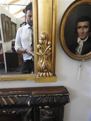 Lot 410 - A large giltwood overmantel mirror