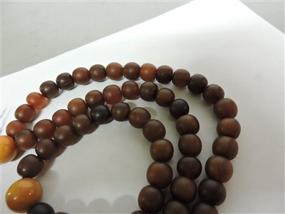 Lot 256 - A Chinese rhinoceros horn bead necklace