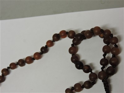 Lot 258 - A Chinese rhinoceros horn bead rosary