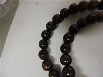 Lot 259 - A Chinese rhinoceros horn bead rosary