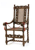 Lot 570 - A William and Mary walnut cane armchair