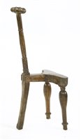 Lot 575 - An unusual, primitive, three-legged 'Cockfighting' chair