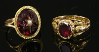 Lot 658 - An 18ct gold single stone flat cut garnet ring