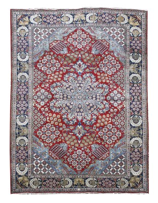 Lot 628 - A Persian red ground carpet