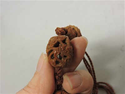 Lot 277 - Two sets of Chinese carved nuts