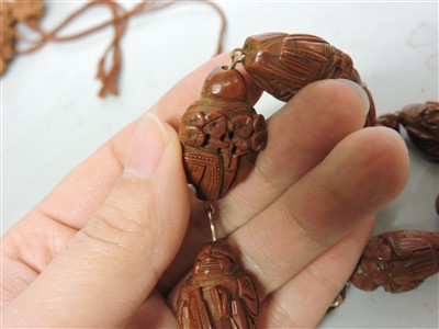Lot 277 - Two sets of Chinese carved nuts