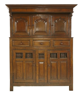 Lot 560 - An oak cupboard