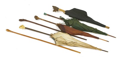 Lot 210 - Five parasols and two walking sticks