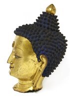 Lot 192 - A Chinese gilt bronze head of Buddha
