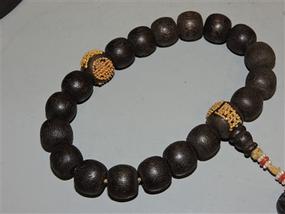 Lot 268 - A Chinese wooden bead rosary