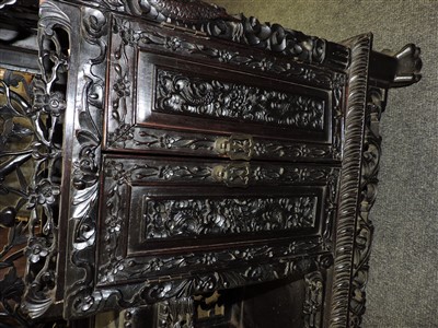 Lot 313 - A Chinese blackwood display cabinet