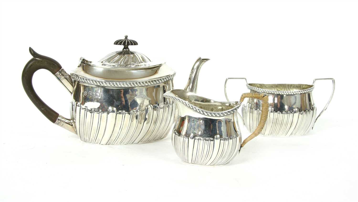 Lot 140 - An early 20th century silver three piece tea service