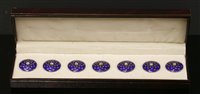Lot 145 - A cased gold and silver set of seven blue enamel dress buttons