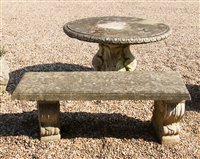 Lot 1083 - A circular reconstituted stone garden table