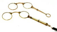 Lot 717 - A pair of gold lorgnettes