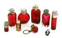 Lot 723 - Eight silver and cranberry glass scent bottles