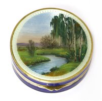 Lot 693 - A silver and enamel circular compact