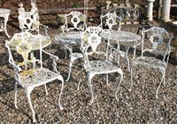 Lot 1082 - A Victorian design white painted cast iron garden suite