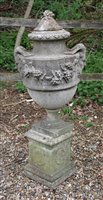 Lot 1132 - A reconstituted stone lidded urn of classical design